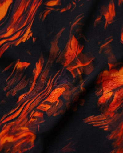 Pantalon flare à motifs marbrés orange et noir