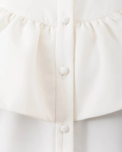 White ruffled shirt dress.